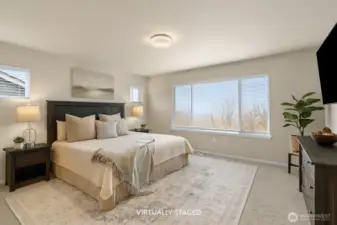 Primary bedroom upstairs, to the left. Window faces the backyard. Separate from other bedrooms.