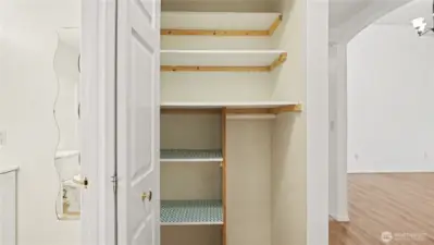 Hall closet offers plenty of storage.