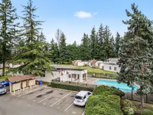 Beautiful complex, surrounded by tall trees and mature landscaping.