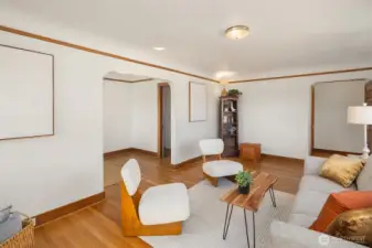 Gorgeous living room with newly finished oak hardwood floor and a inviting wood fireplace