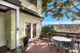 Large, private deck off the kitchen with amazing views of the Mt Rainier and the Olympics and overlooking the serene, park-like backyard