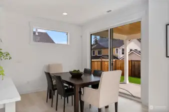 Breakfast nook leads out to nice sized covered patio & back yard.