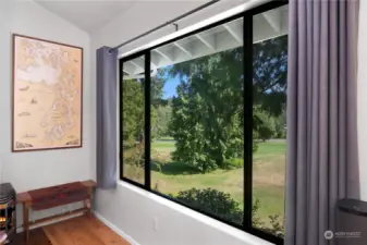 The large picture window in the living room faces SE. Sellers removed the old baseboard heating and now have a modern mini-ductless heating and cooling system.