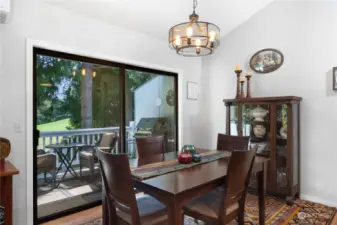 The dining area has vaulted ceilings and access to the private trek-like deck overlooking the fairway.