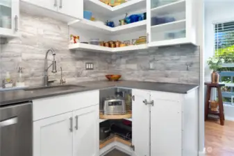 Wow! Custom cabinets, European Infinity Porcelain countertops, modern open shelving and Bosch dishwasher!