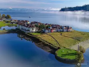 Mt Baker looms in the background over Port Ludlow Bay and the Inn and townhouses in Port Ludlow.