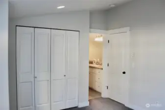 view of closet and full bath entry