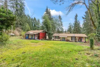 Backyard view showing detached office space