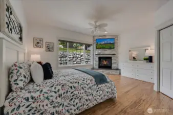 Guest suite off the entry with walk-in closet, gas fireplace and 3/4 bath. Mounted TV conveys.