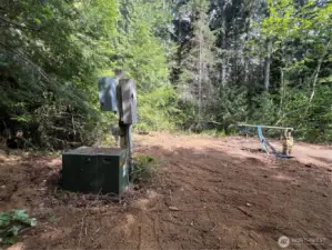 This DOT well/power is located on the lower section of lot 8 - The upper loop of Lot 8 is the more ideal build location with more level, usable space.