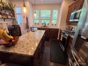 Beautiful Granite Counters with prepping island, a true Cook's Kitchen Delight. You will really enjoy cooking here!