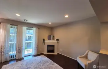 Large Living Room with Gas Fireplace & newer laminate flooring throughout the home.