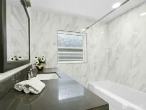 Quartz countertop vanity, Large bathtub with shower, medicine cabinet above the toilet