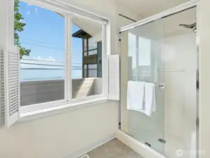 Main Bathroom window faces the Puget Sound. Cafe/Beach Styled Window Shutters for privacy incase someone is on the 2F Balcony