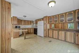 Dining area with ample built-in storage and convenient access to the kitchen.