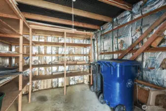 Enclosed storage area with sturdy shelving- ideal for tools, bins, and seasonal items.