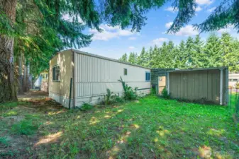 Spacious backyard with storage shed and room to create your own outdoor retreat.