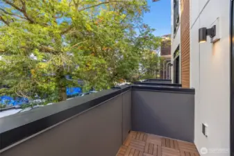 Lovely view from walkout balcony.  Photo is of model home of same floorplan. Color schemes of finishes may vary.