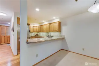 Beautiful wood floors in hallways and kitchen.