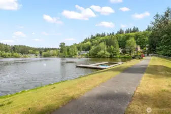 Community park has a playground, kayak storage, sports court, beach area, gazebo and dock.