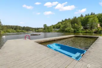 Community park has a playground, kayak storage, sports court, beach area, gazebo and dock.