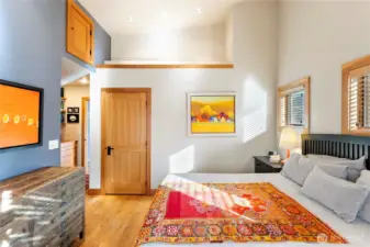 The primary bedroom has good storage, including beautiful built-in cabinetry.