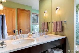 The primary bathroom has a double sink and high-quality fixtures.