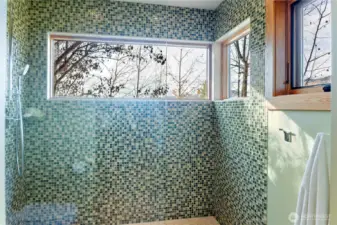 Each bathroom is fitted with custom tilework -- and some have exterior views too!