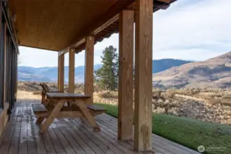 The home has a large covered porch for indoor/outdoor living or a place to enjoy the remarkable ranch setting.