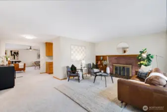 Step into the cozy formal living room with a charming wood-burning fireplace, perfect for relaxing evenings.