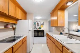 Look-through area above sink lets you stay connected to the conversation while preparing meals, making cooking more enjoyable.