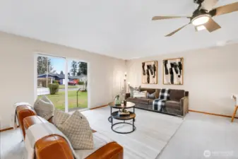 Sliding glass doors effortlessly lead to the exterior yard, creating a seamless transition between indoor and outdoor living.