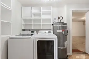 Washer/dryer and entryway to the attached 1 car garage