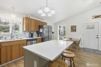 Another view of the kitchen along with the eating area