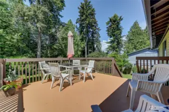 Entertainment size deck located just off the great room / and kitchen area.   Enjoy the view of your gorgeous private backyard.