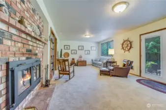 Lower floor family room and game area with 3rd fireplace.