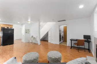 Looking toward the kitchen - laundry room, and a powder room plus garage access.