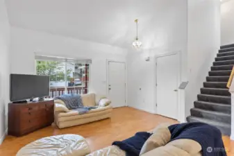 Looking towards the front door - coat closet and stairs leading to your bedrooms