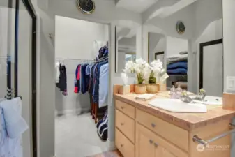 The 2nd Primary hosts a 3/4 Bath with Large Shower with Etched Glass, one of four Power Flush Toilets, another Skylight, Dual Mirrored Medicine Cabinet and a generous Walk In Closet.