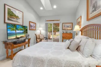 Down the Guest Hallway is this warm and inviting 3rd Bedroom with dimmable can lighting, large Skylight, access to the English Garden through the Slider, a large upper lighted display niche and a full-bath across the hall.