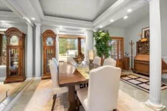 Perfectly placed Formal Dining between the Kitchen and the Huge Picture Window with a Great View.