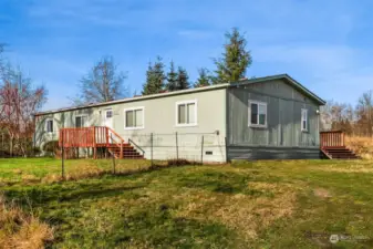 bright and spacious double-wide manufactured home, beautifully updated and set on a private acre with breathtaking Cascade views.