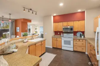 Maple cabinetry and granite tile counters.