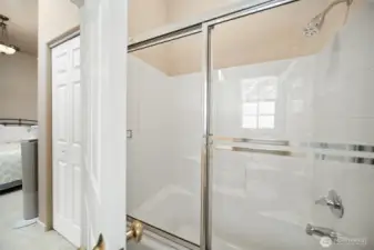 Primary bathroom with tub & shower.