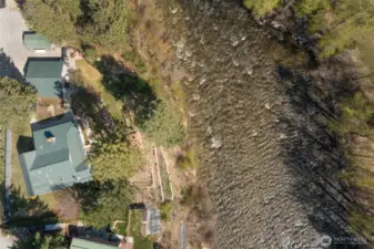 Aerial from above...looking down on home, garage, and carport.