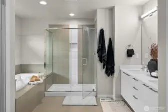 A stunning spa-like bathroom with large soaking tub and party shower, YES PLEASE!