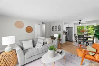 Living & Dining Areas (and a peek into the Kitchen) - Luxury Vinyl Plank Flooring, contemporary lighting and large windows are found throughout the home.
