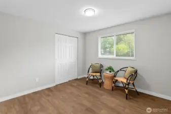 Bedroom #2 - Views of the lush front yard.  Full closet...