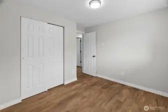 Bedroom #3 From the far corner, shows the closet and door to the hallway.
