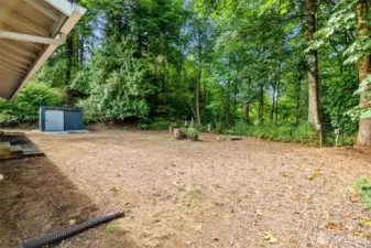 The cleared backyard is ready for topsoil & seed or hydroseed! A sizable garden shed has space to hold your lawn mower and other gardening equipment.